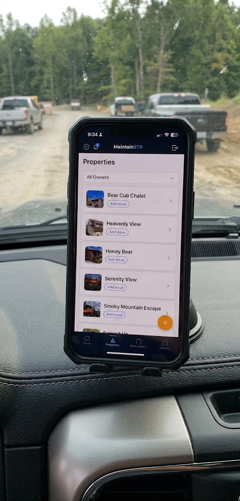 Phone on a truck dash showing the MaintainSTR app properties screen