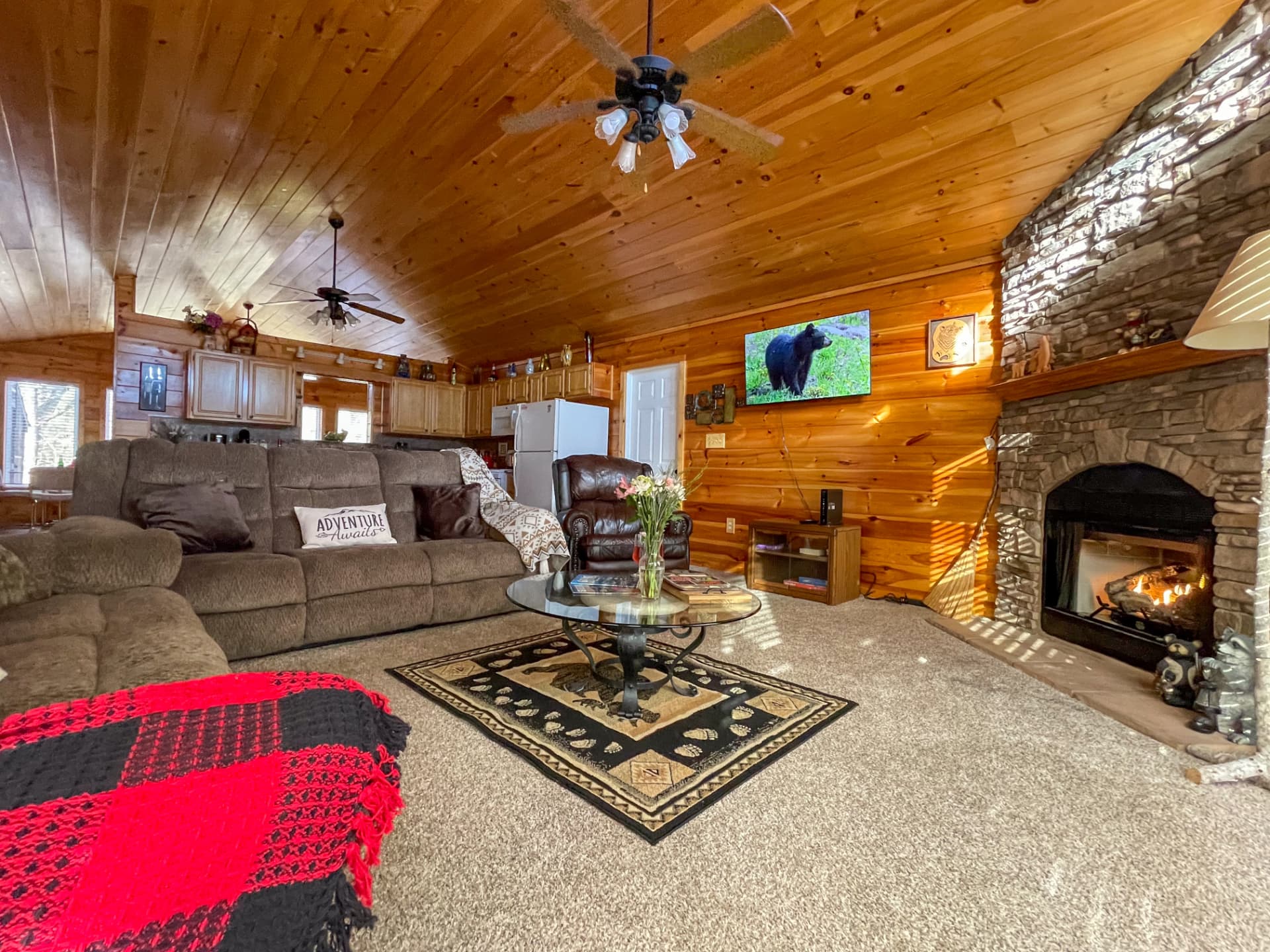 Clean, well-maintained cabin living room and kitchen
